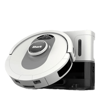 a shark robotic vacuum cleaner on a black background